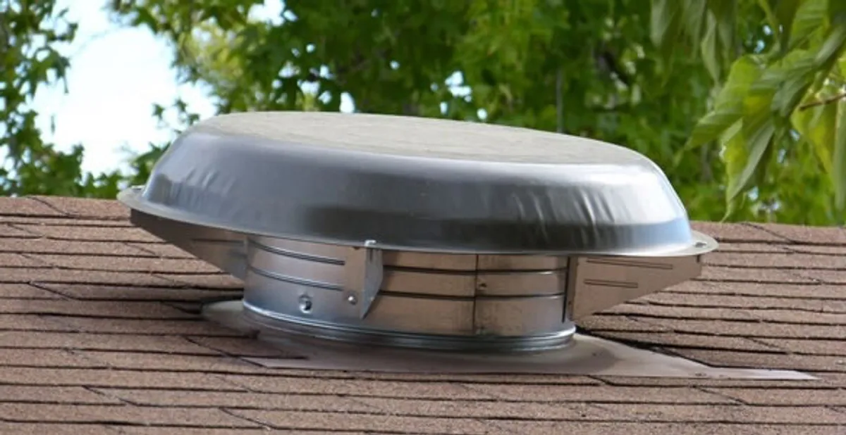 attic fan installation services with low-profile roof ventilation unit in Houston, TX