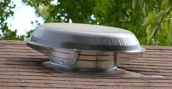 attic fan installation services with low-profile roof ventilation unit in Houston, TX