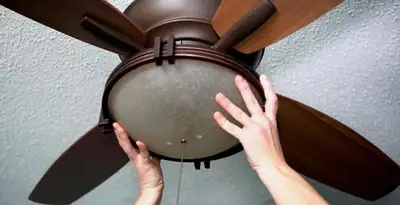 Ceiling fan repair and reinstallation on ceiling mount in Houston, TX