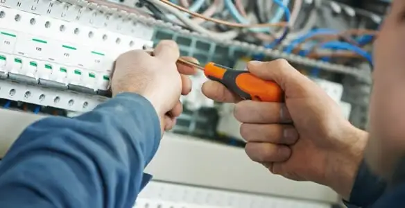 electrical service showing licensed electrician performing electrical panel maintenance and adjustments in Houston, TX