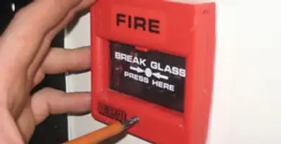 fire alarm installation service showing manual fire alarm pull station installed by licensed electricians in Houston, TX