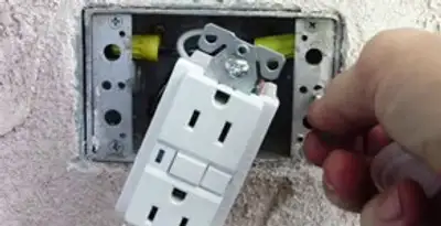 gfci circuits service showing installation of a ground fault circuit interrupter outlet by licensed electricians in Houston, TX