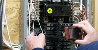 Home electrical inspection of circuit breaker panel by licensed electrician in Houston, TX