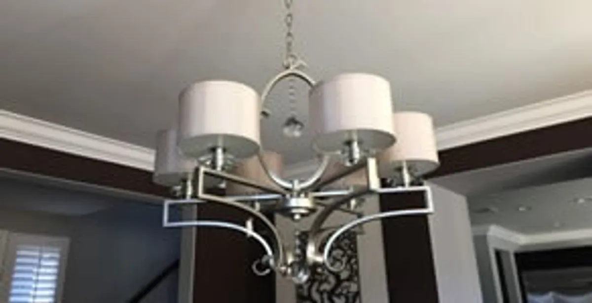 Modern chandelier installation with multiple light fixtures in Houston, TX