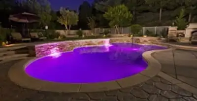 pool light installation and repair services illuminating a residential swimming pool in Houston, TX