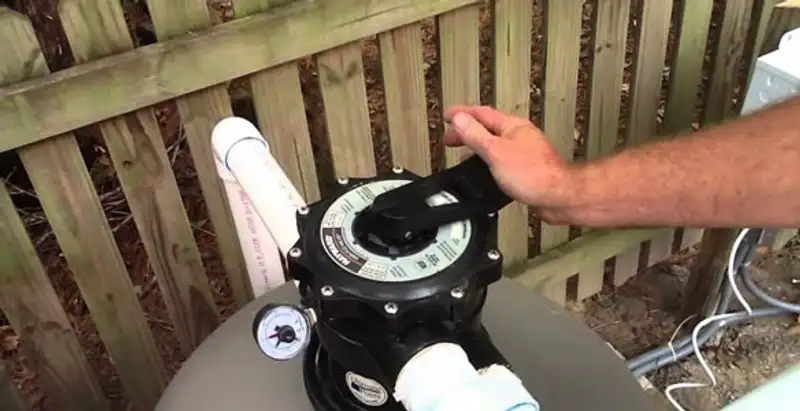 pool pumps service showing professional adjustment of pool pump control system in Houston, TX