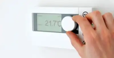 Thermostat installation service with professional adjusting temperature control in Houston, TX