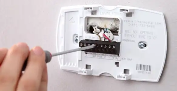 Thermostat installation service with proper wiring and secure wall mounting in Houston, TX