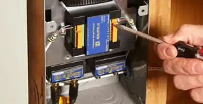 Whole home surge protection device being installed by a licensed electrician to protect electrical systems in Houston, TX